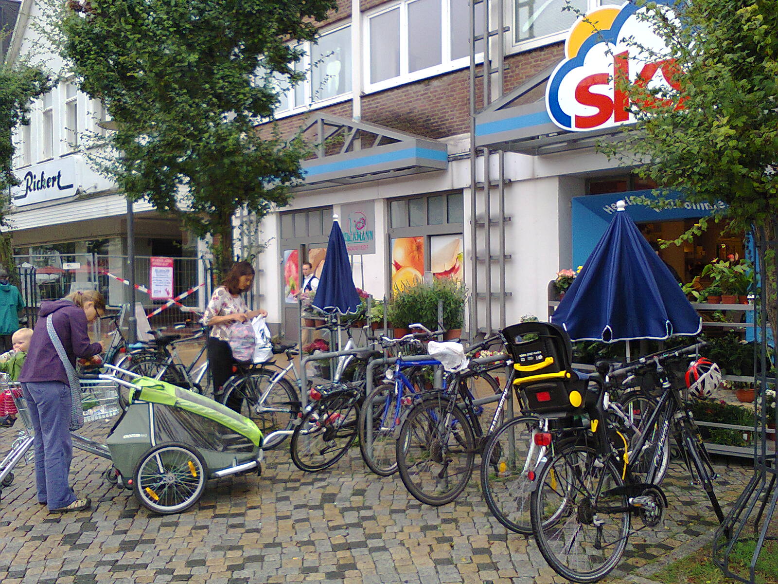 Cycle parking outside a small supermarket
