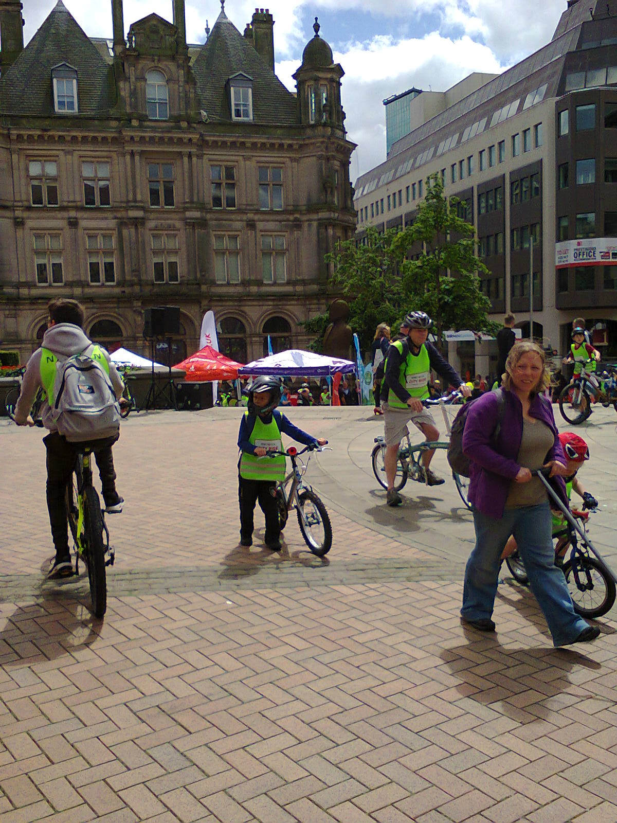 children and adults with bikes