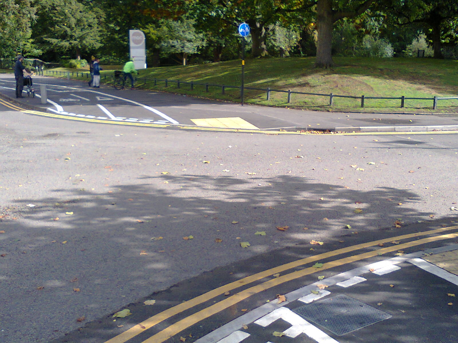 The entrance to Cannon Hill car park, with give-way markings for the cycle track.
