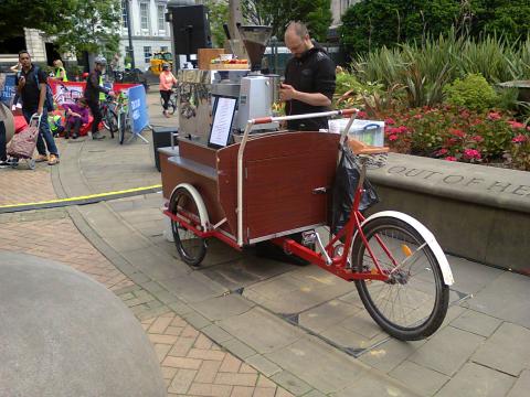 a mobile coffee stand built into a cargo trike